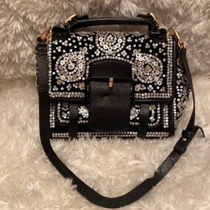 Tory Burch black suede beaded purse.